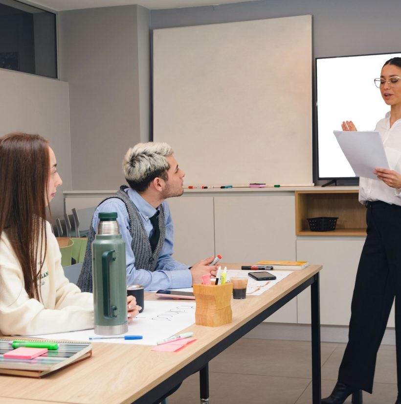 woman reading and explaining company marketing strategy steps